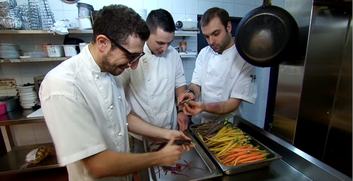 Chefs preparing food at Angelo's on the Bay