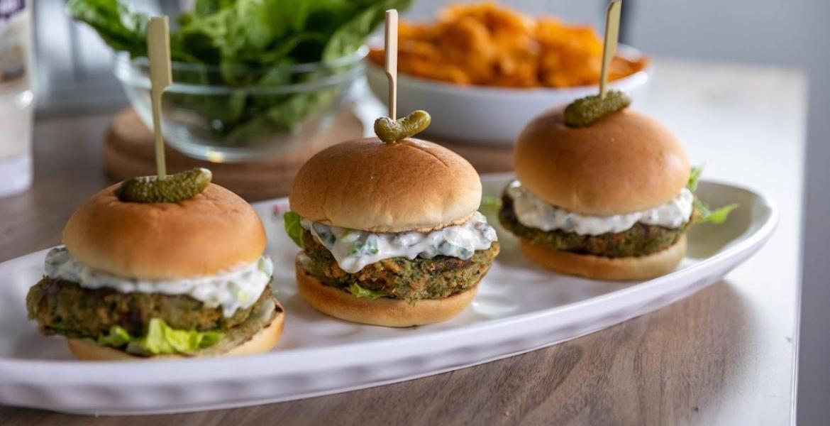 three burgers on a serving platter