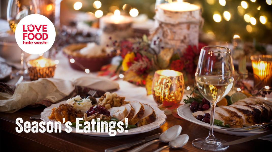 table set out with Christmas dinner and lights